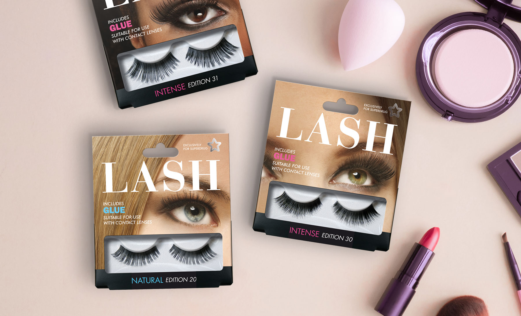 Superdrug Lash products with make up products on a soft pink background design by Biles Hendry